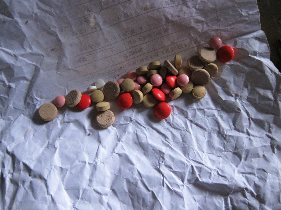 A conglomeration of medications chronically taken by a villager.